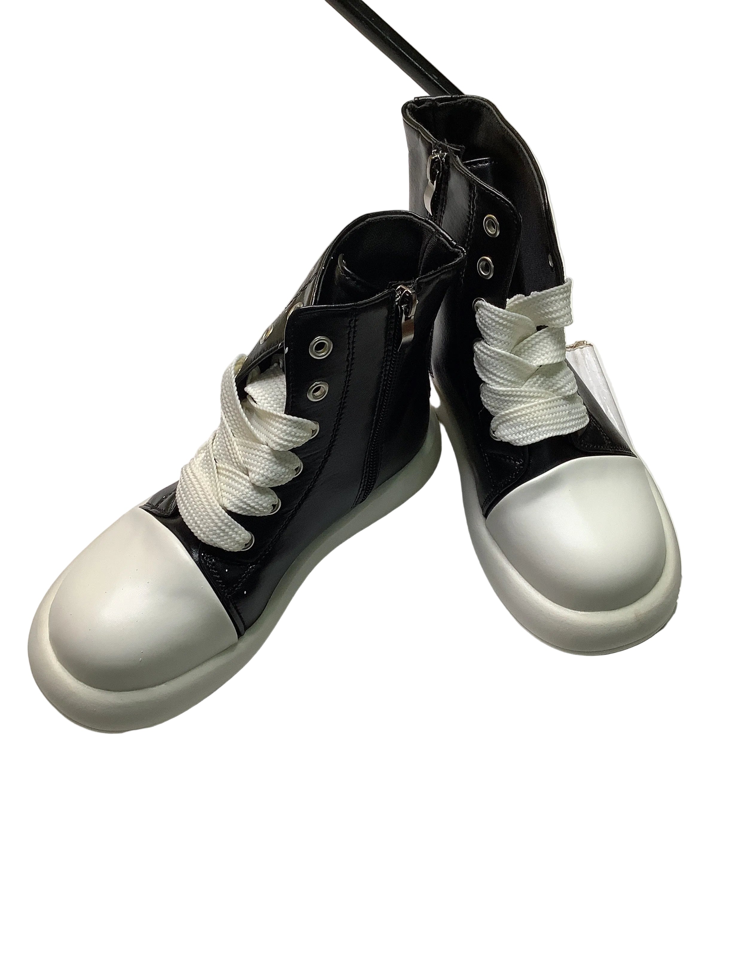 High Top Boots With White Sole.